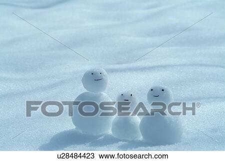 Stock Image - Tiny snowmen. Fotosearch