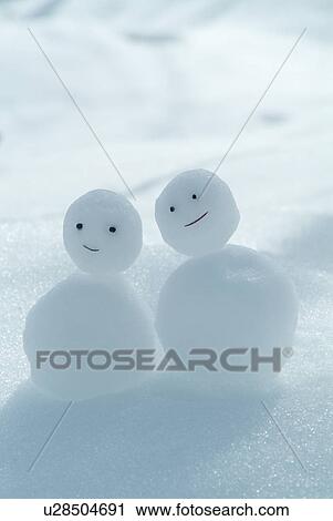 Stock Image - Tiny snowmen. Fotosearch