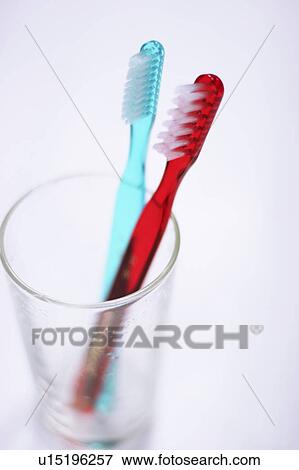 Stock Photo - Toothbrushes in a glass. Fotosearch