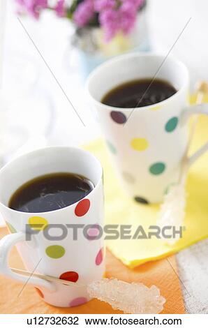 Two coffees on table View Large Photo Image Stock Image - Two coffees on table. Fotosearch