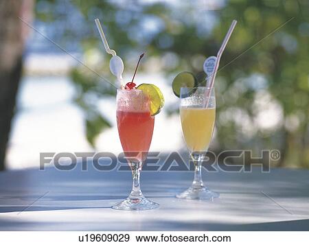 Stock Photo - Two daiquiris on a table outdoors. Fotosearch