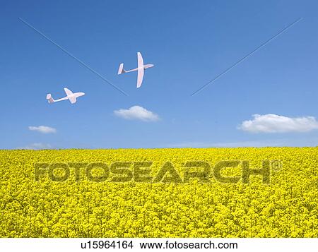 Two paper airplane flying in the sky View Large Photo Image Picture - Two paper airplane flying in the sky. Fotosearch