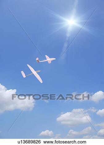 Two paper airplane flying in the sky View Large Photo Image Stock Photograph - Two paper airplane flying in the sky. Fotosearch