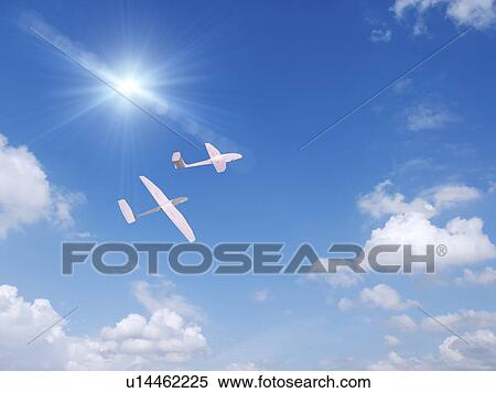Stock Photography - Two paper airplane flying in the sky. Fotosearch