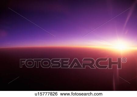 View of sunset from airplane, long exposure, copy space View Large Photo Image Stock Photograph - View of sunset from airplane, long exposure, copy space. Fotosearch
