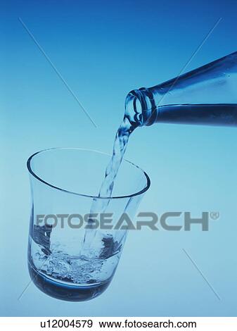 Water being poured into a glass View Large Photo Image Stock Photo - Water being poured into a glass. Fotosearch