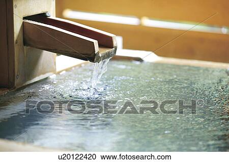 Water flowing into Hinoki open-air bath View Large Photo Image Stock Image - Water flowing into Hinoki open-air bath. Fotosearch