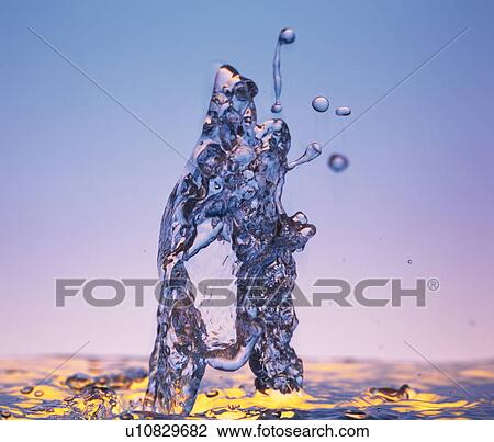 Stock Image - Water spraying upwards like a fountain. Fotosearch