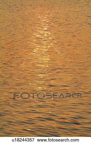 Stock Photo - Water surface at dusk. Fotosearch
