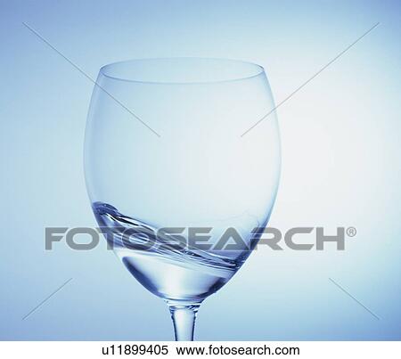 Stock Photography - Water swirling in a wineglass. Fotosearch