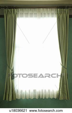 Window framed with green tasseled curtains View Large Photo Image Stock Image - Window framed with green tasseled curtains. Fotosearch
