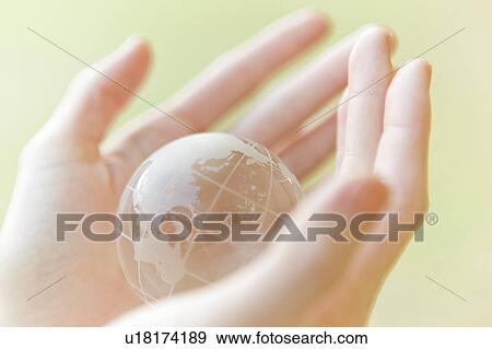 Woman holding globe in hands, close up View Large Photo Image Stock Photo - Woman holding globe in hands, close up. Fotosearch