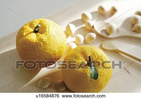 Stock Photograph - Yuzu citron and nuts. Fotosearch