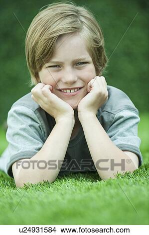 Picture - Boy looking at camera. Fotosearch