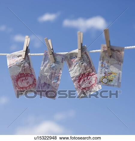 Stock Photo - British pounds on clothes line. Fotosearch