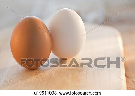 Brown and white eggs View Large Photo Image Stock Photo - Brown and white eggs. Fotosearch