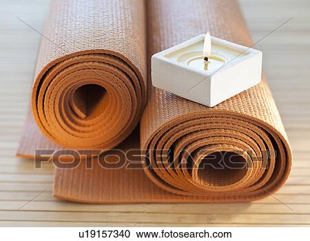 Stock Image - Candle on underpadding. Fotosearch