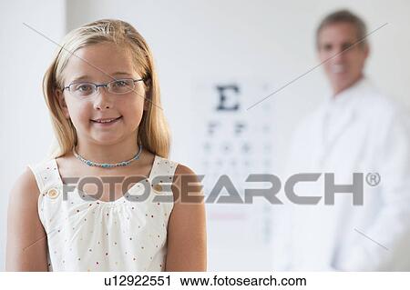 Stock Image - Child at eye doctor. Fotosearch