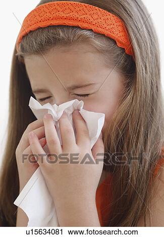 Stock Image - Child blowing nose. Fotosearch