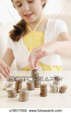Stock Photography - Child paying with money. Fotosearch