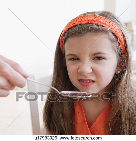 Child turning up nose to medicine View Large Photo Image Stock Photograph - Child turning up nose to medicine. Fotosearch