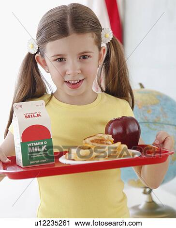 Stock Image - Child with lunch at school. Fotosearch