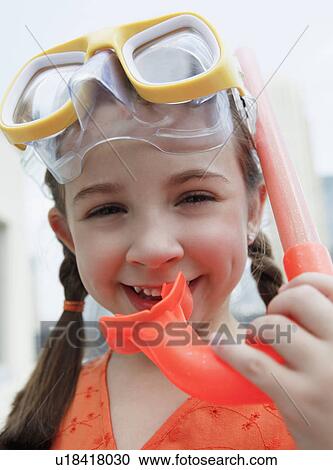 Stock Image - Child with mask and snorkel. Fotosearch