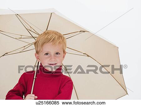 Stock Photography - Child with umbrella. Fotosearch