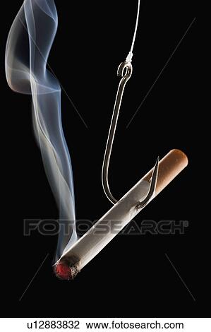 Stock Image - Cigarette with fishing hook. Fotosearch