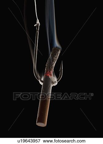 Cigarette with fishing hook View Large Photo Image Stock Photo - Cigarette with fishing hook. Fotosearch