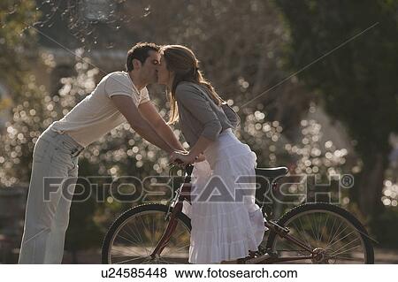 Stock Photo - Couple kissing. Fotosearch