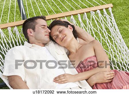 Couple on hammock View Large Photo Image Stock Image - Couple on hammock. Fotosearch