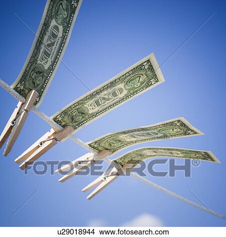 Picture - Dollars on clothes line. Fotosearch