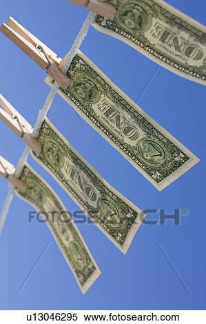 Stock Photography - Dollars on clothes line. Fotosearch