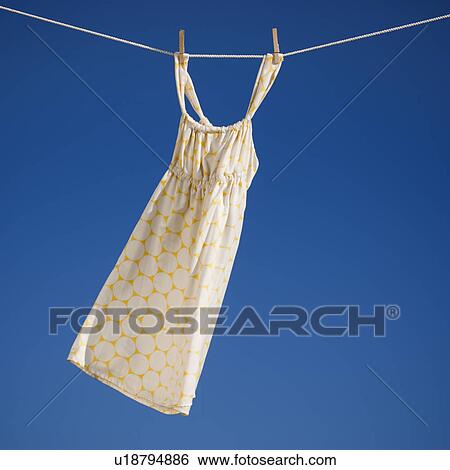 Dress on clothes line View Large Photo Image Stock Photograph - Dress on clothes line. Fotosearch