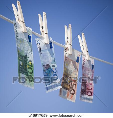 Stock Photo - Euros on clothes line. Fotosearch