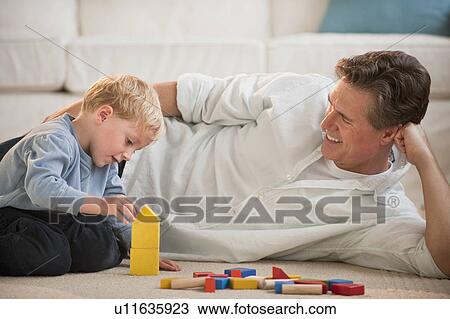 Father and child at home View Large Photo Image Stock Image - Father and child at home. Fotosearch