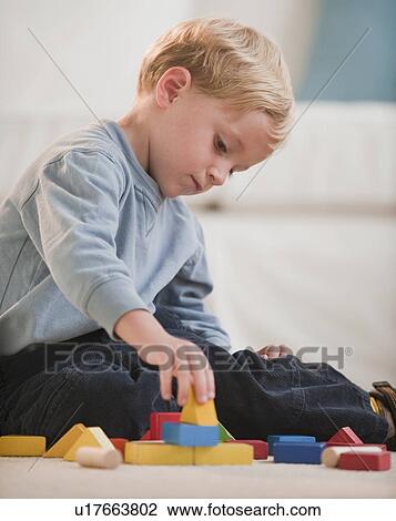 Stock Image - Father and child at home. Fotosearch