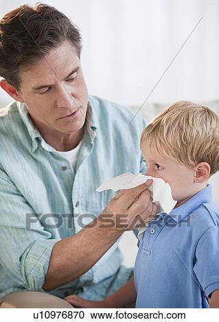 Father wiping child's nose View Large Photo Image Stock Image - Father wiping child's nose. Fotosearch
