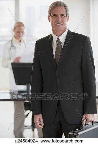 Female doctor and salesman View Large Photo Image Picture - Female doctor and salesman. Fotosearch