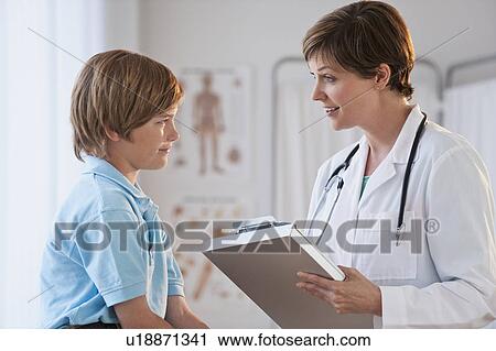 Stock Image - Female doctor with child. Fotosearch