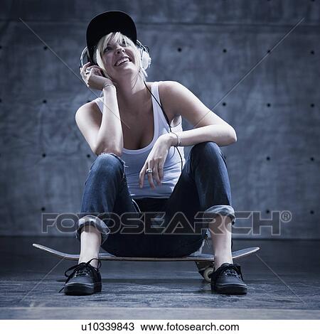 Female skateboarder on phone View Large Photo Image Stock Image - Female skateboarder on phone. Fotosearch