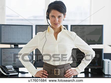 Picture - Female trader looking at camera. Fotosearch