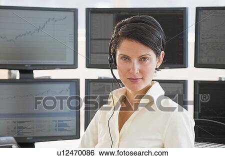 Female trader looking at camera View Large Photo Image Stock Photograph - Female trader looking at camera. Fotosearch