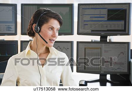 Female trader on headset View Large Photo Image Stock Photo - Female trader on headset. Fotosearch