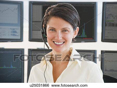 Female trader on headset View Large Photo Image Stock Photograph - Female trader on headset. Fotosearch