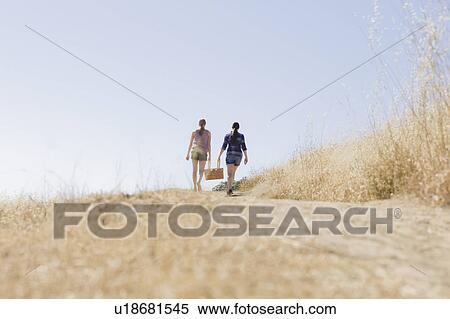 Freinds walking to picnic View Large Photo Image Stock Photography - Freinds walking to picnic. Fotosearch
