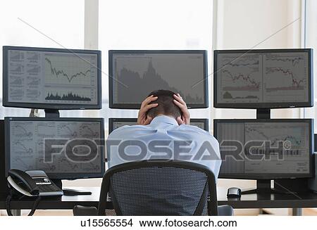 Picture - Frustrated male trader at work. Fotosearch