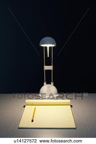 Stock Image - Light and pad of paper. Fotosearch