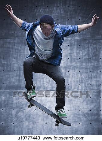 Stock Image - Male Skateboarding. Fotosearch